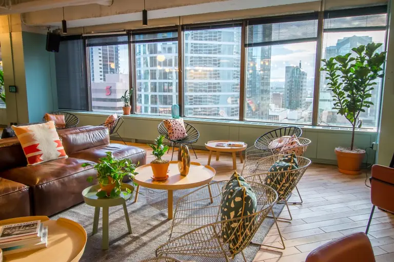 Digi117's bright Vancouver office lounge with downtown skyline views